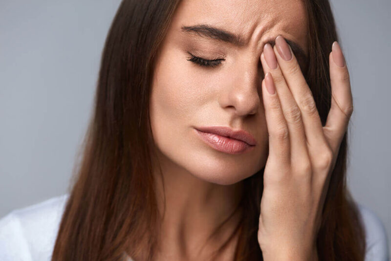 Woman suffering from dry eye